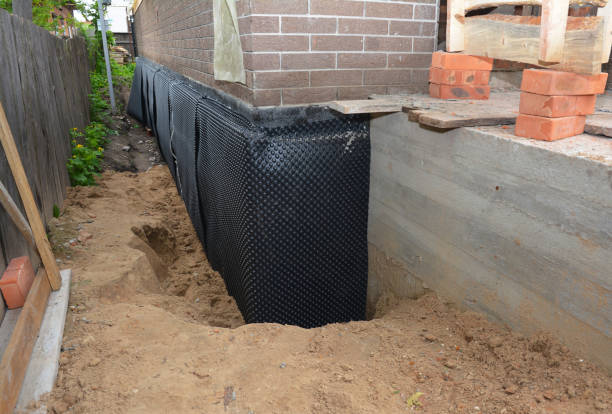 Happy homeowners after waterproofing job in Brightwaters